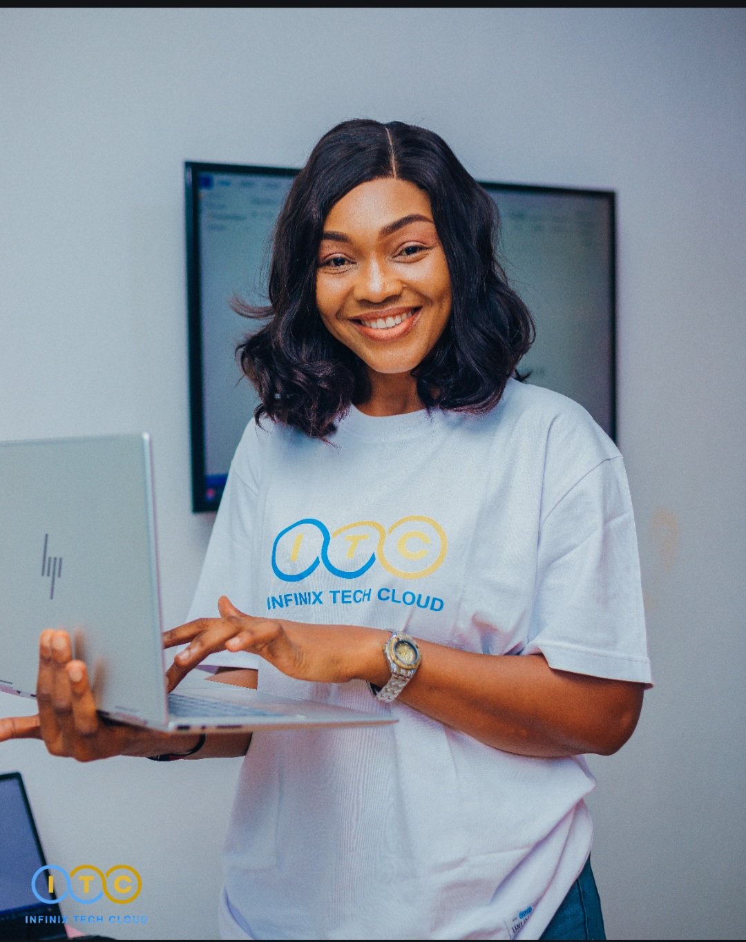 Infinix Tech Cloud student with laptop